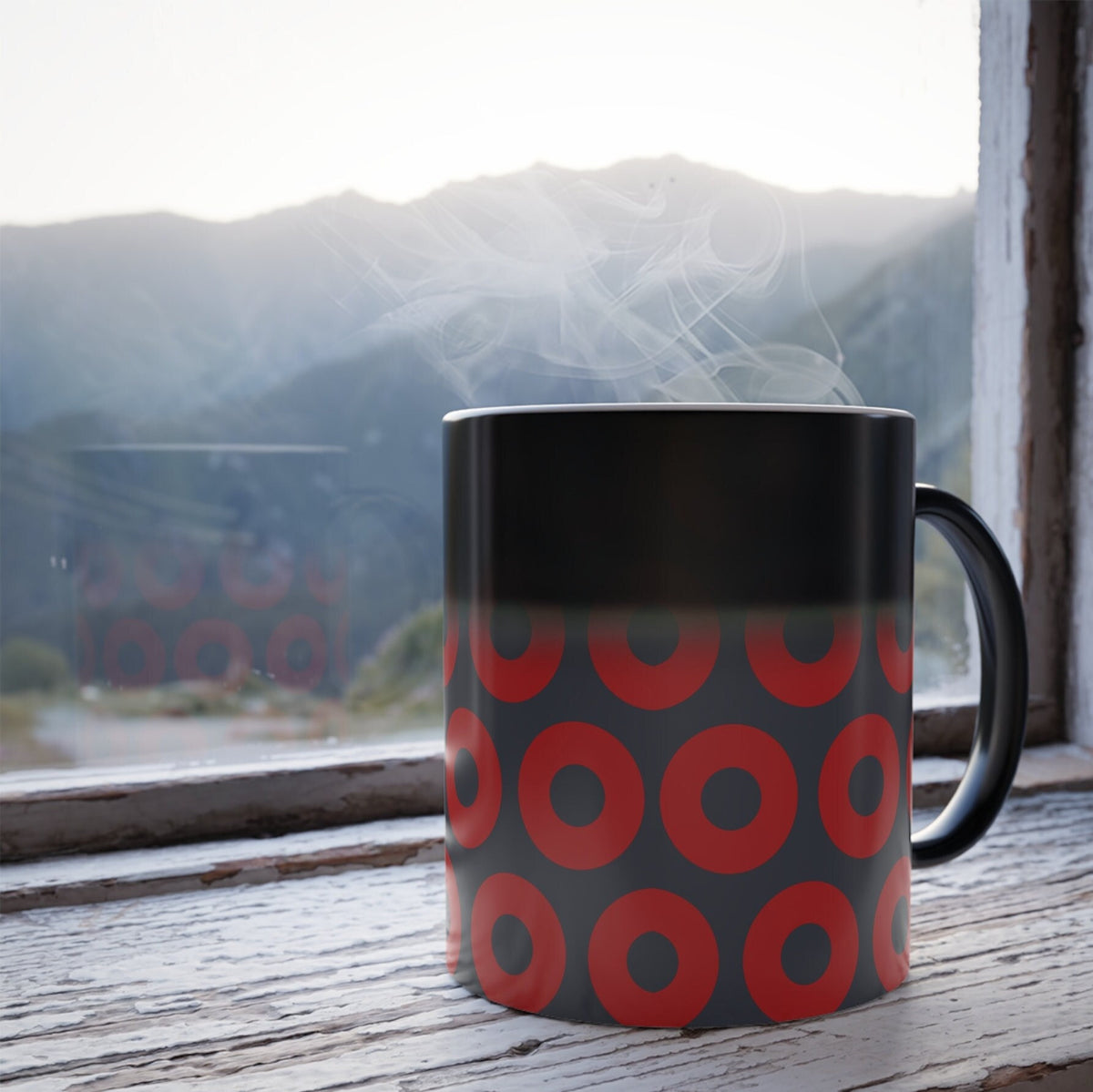 Black heat-reveal mug with red and blue Fishman donut pattern